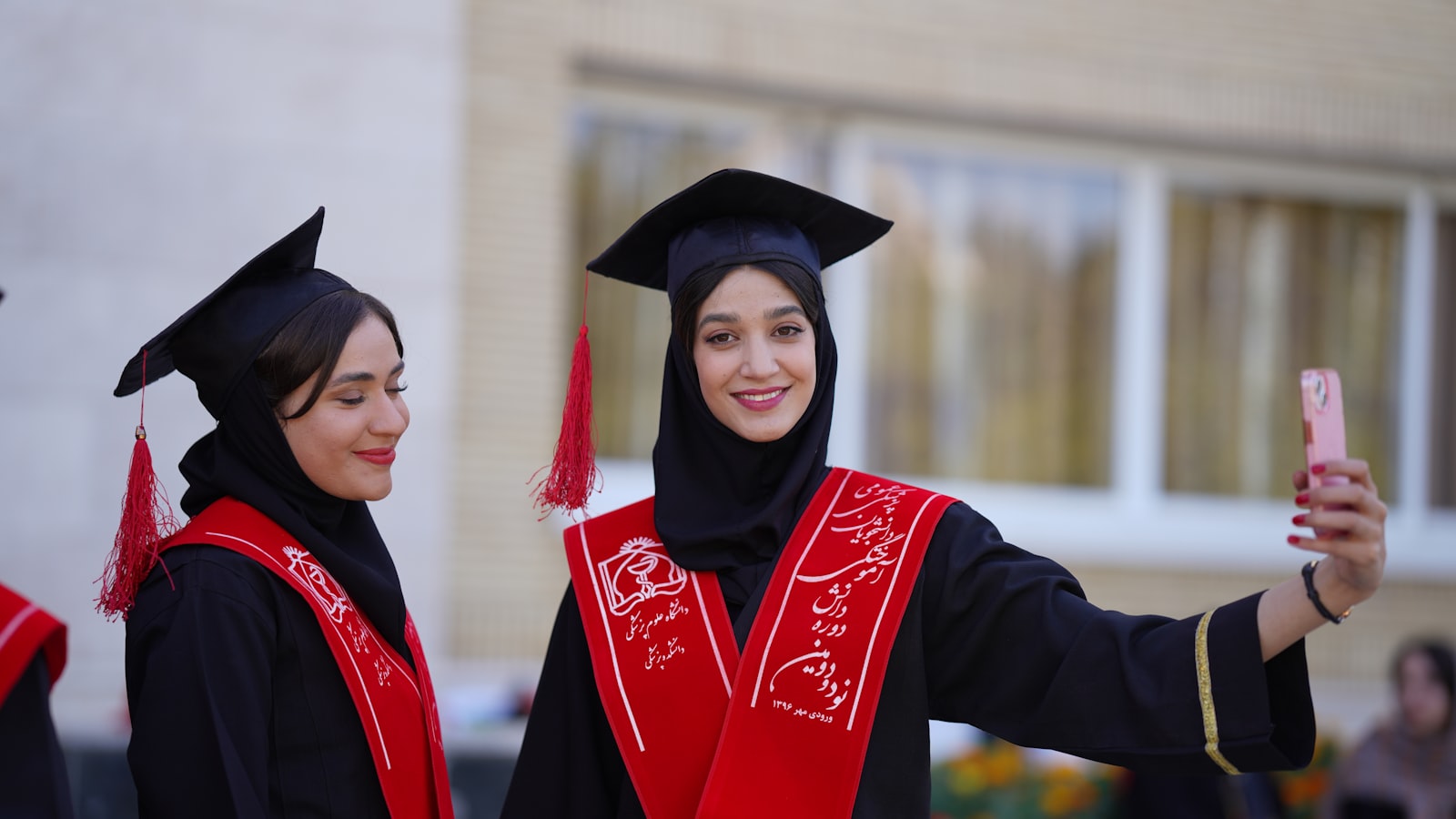 Graduates pose for a selfie at their ceremony.