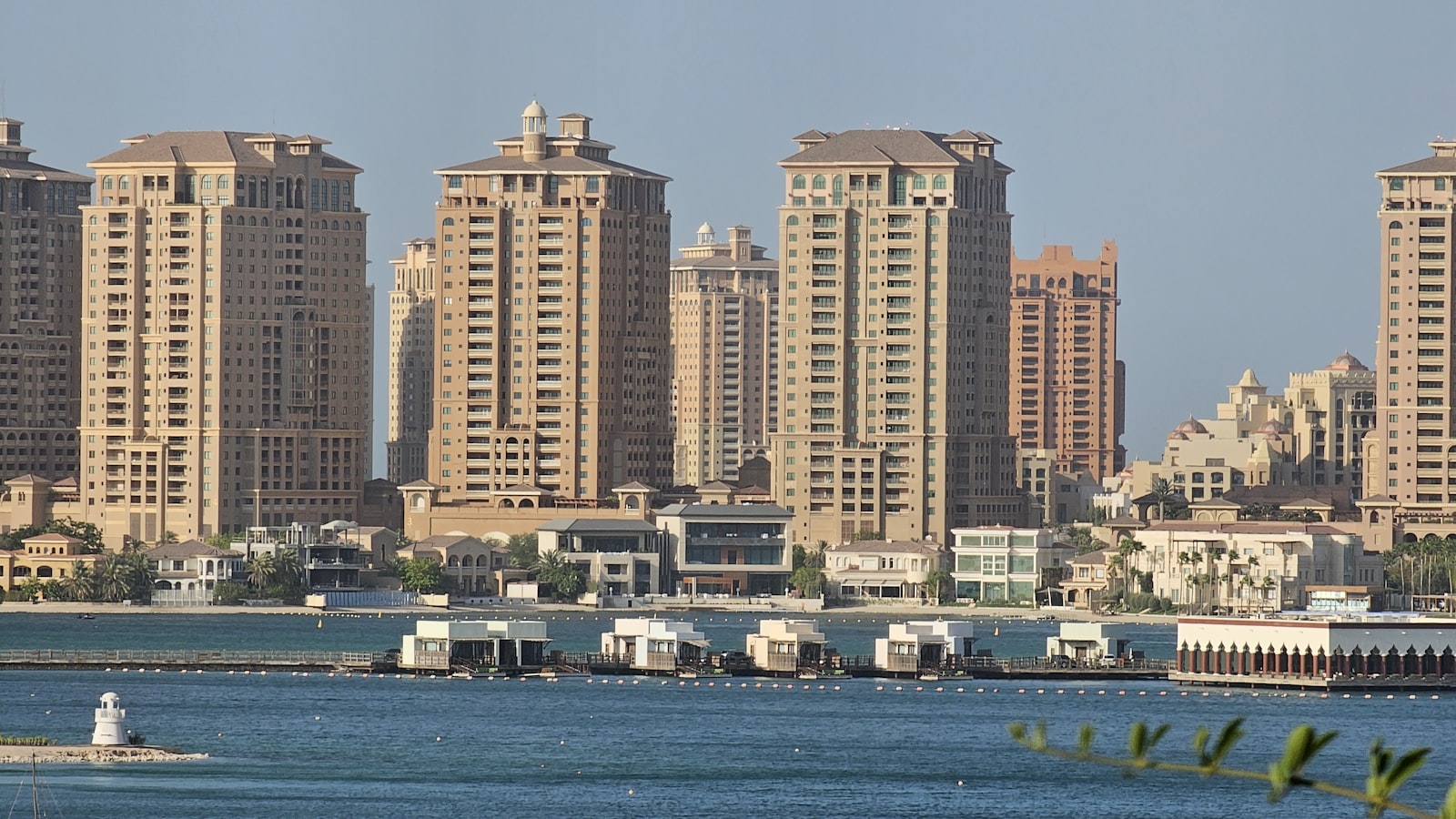 a body of water with a bunch of buildings in the background