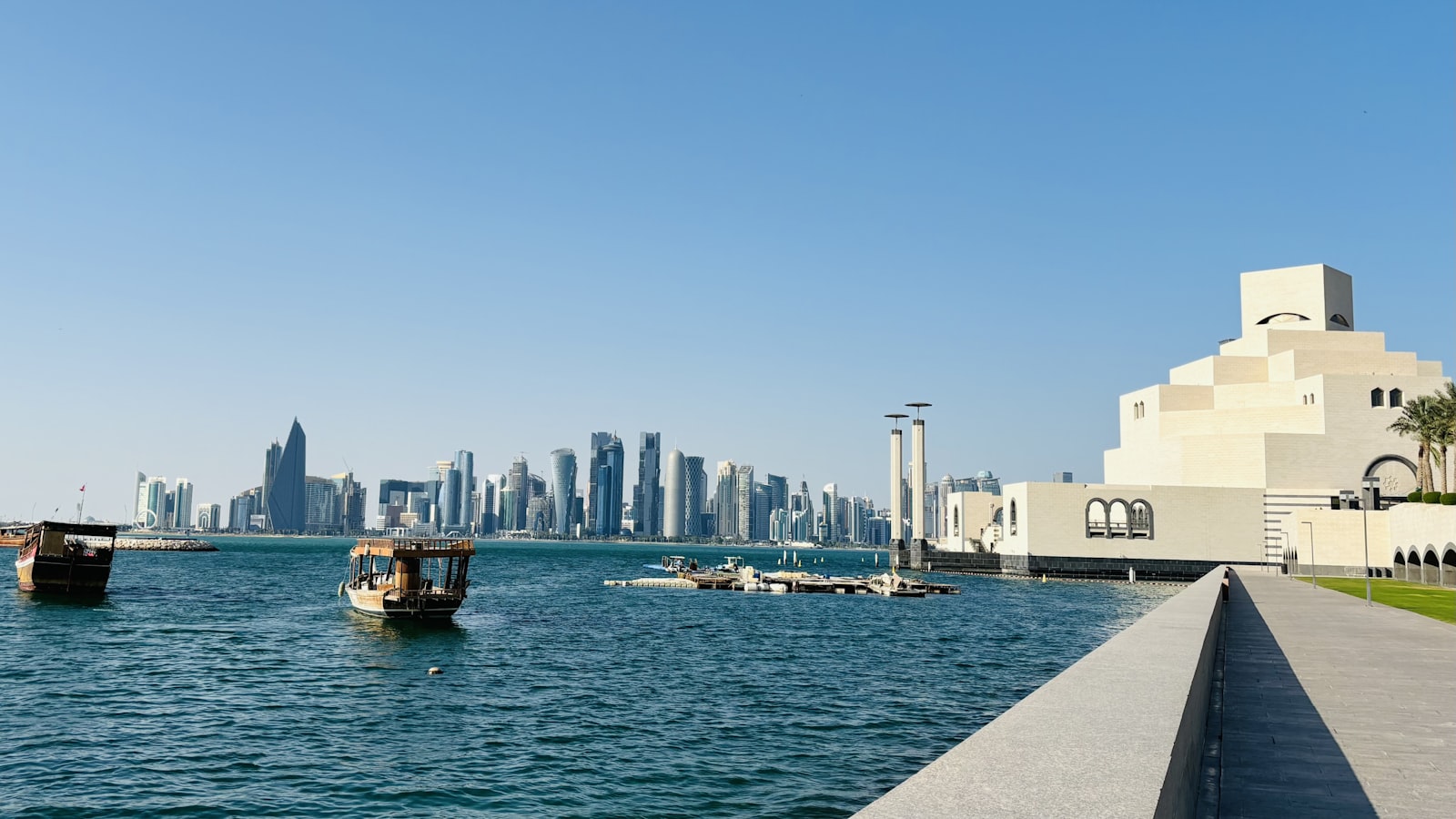 A body of water with a city in the background