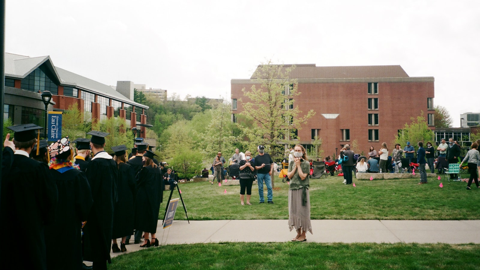 people standing on green grass field during daytime