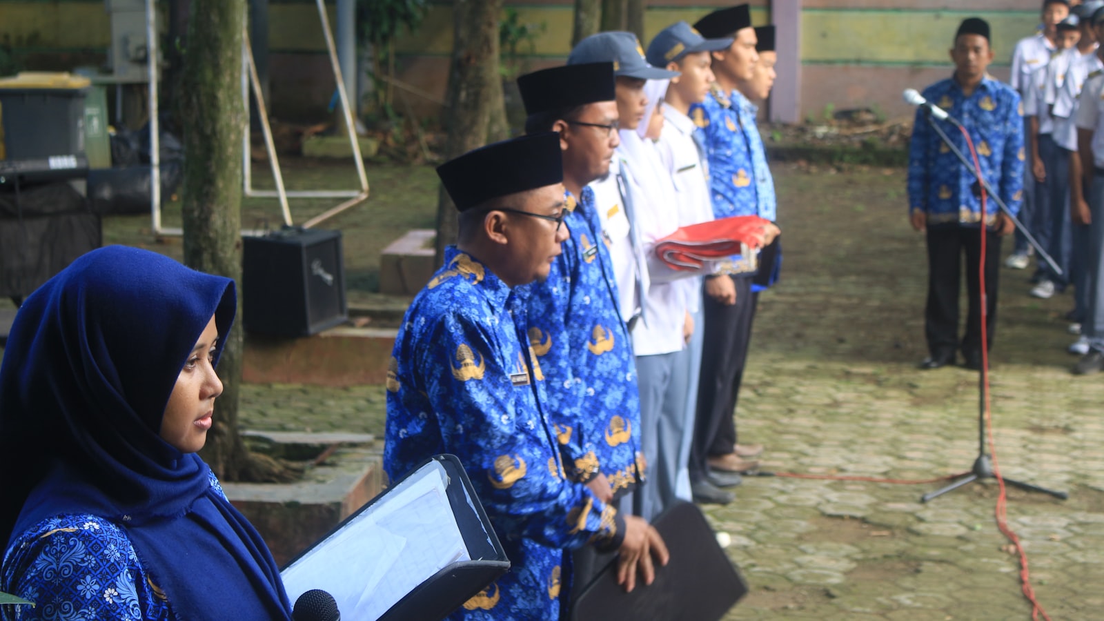 Group of people in uniform standing in a line.