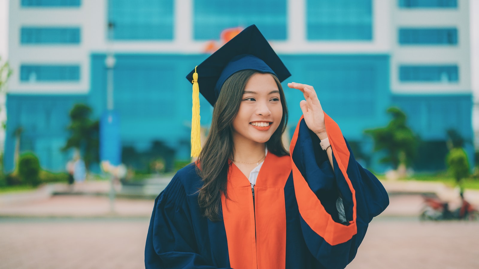 a woman in a graduation cap and gown
