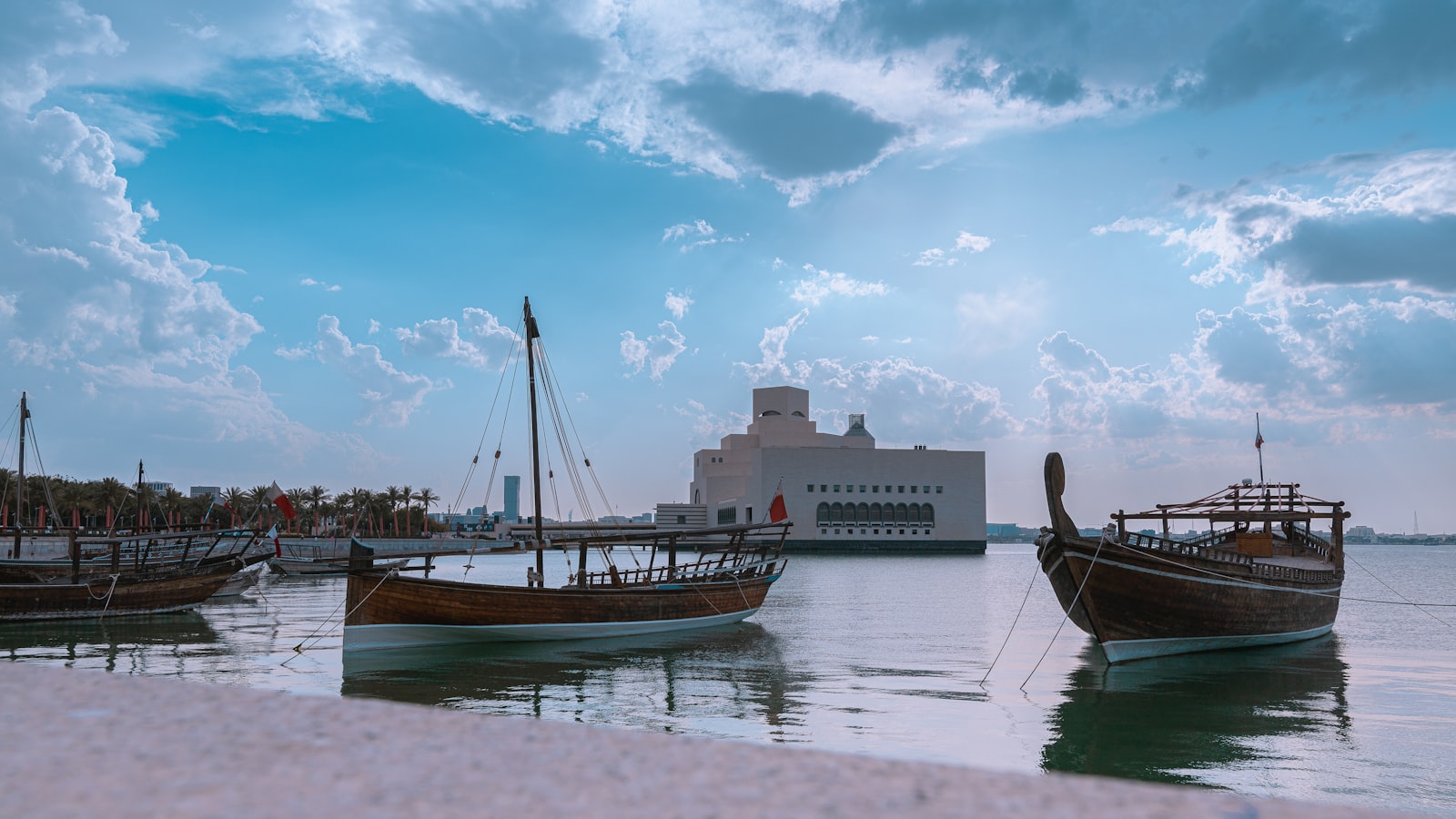 a group of boats that are sitting in the water