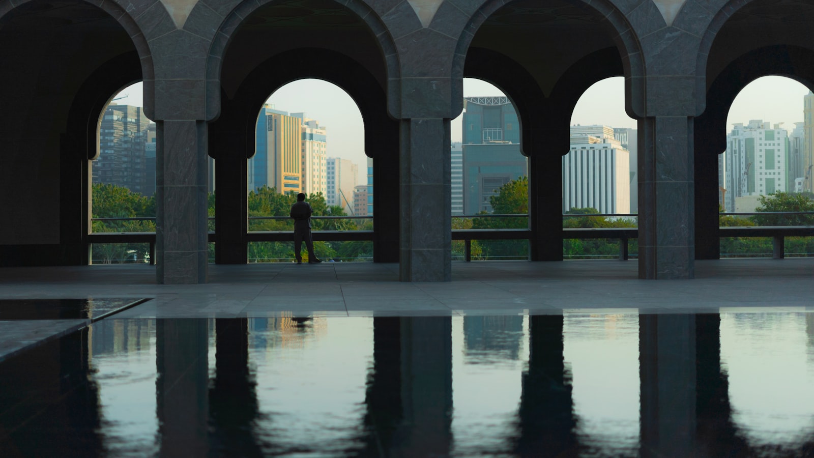 white concrete building near body of water during daytime