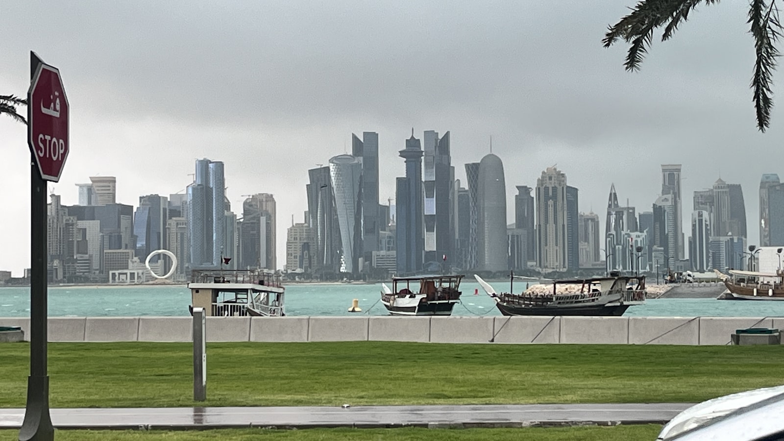 a view of a city skyline with boats in the water
