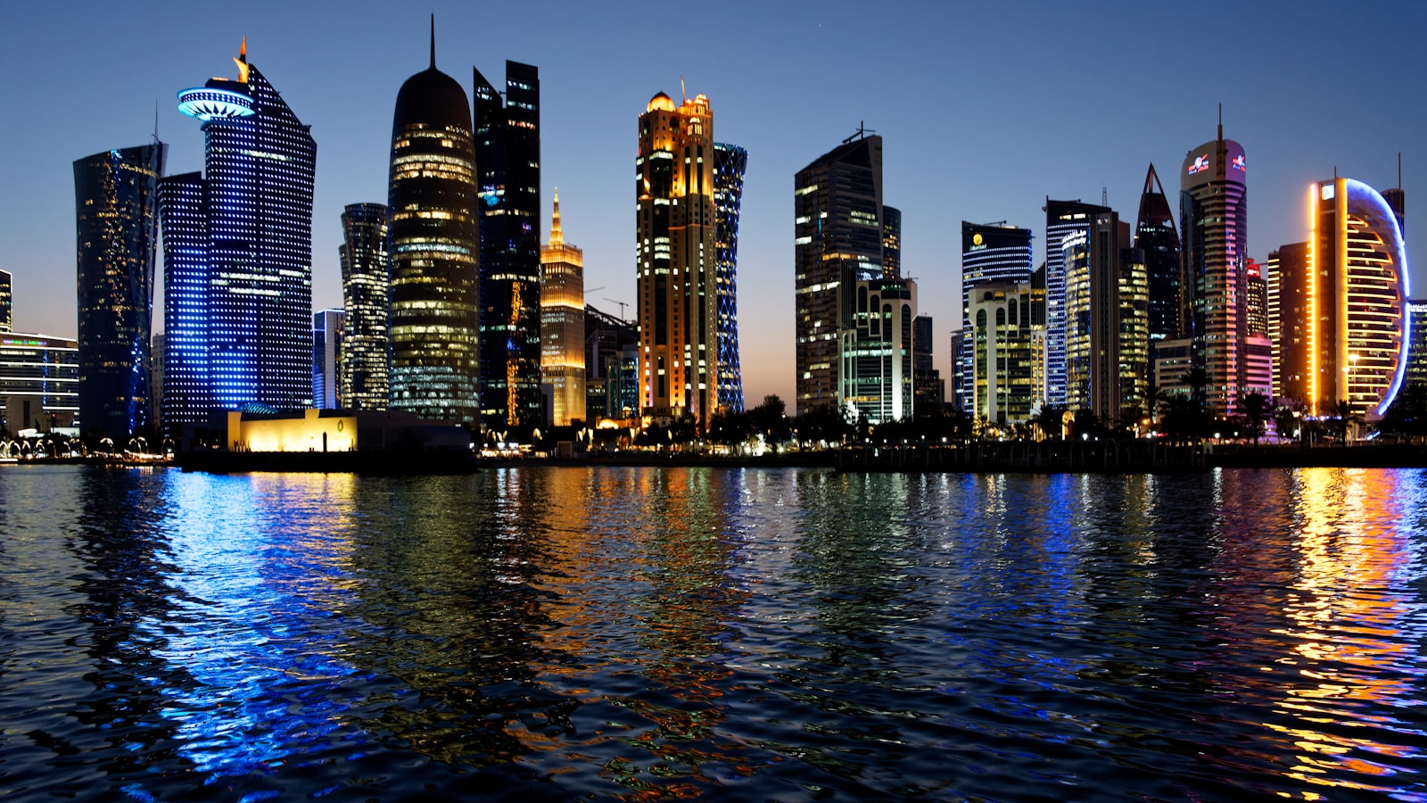 A view of a city at night from across the water