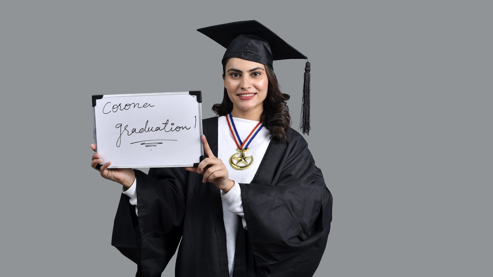 a person holding a diploma and a diploma