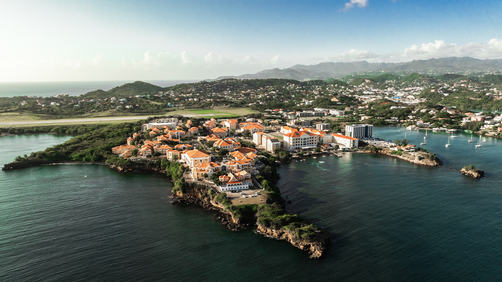 Coastal town with colorful buildings on a peninsula.