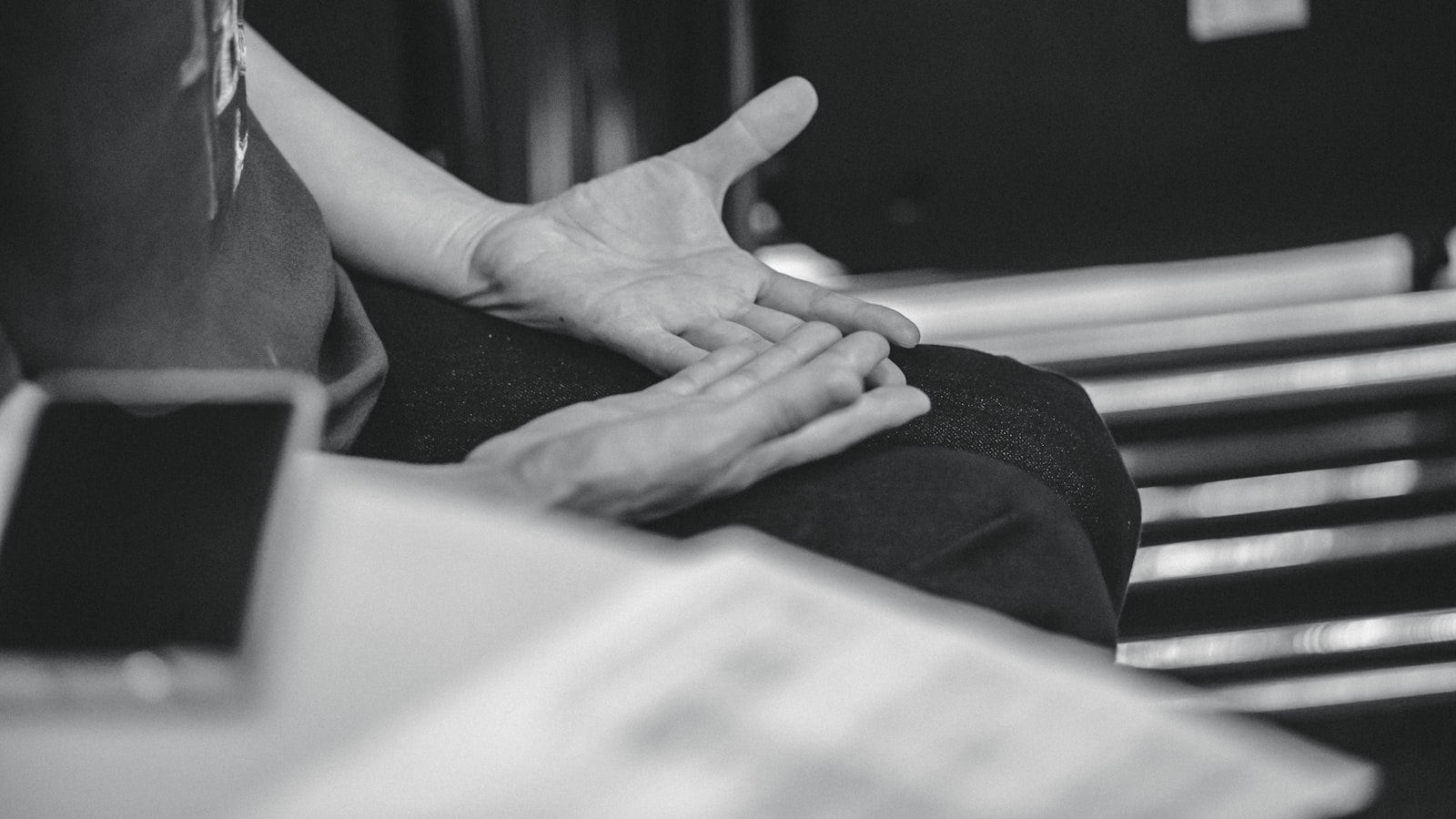 Person gesturing with hands during conversation