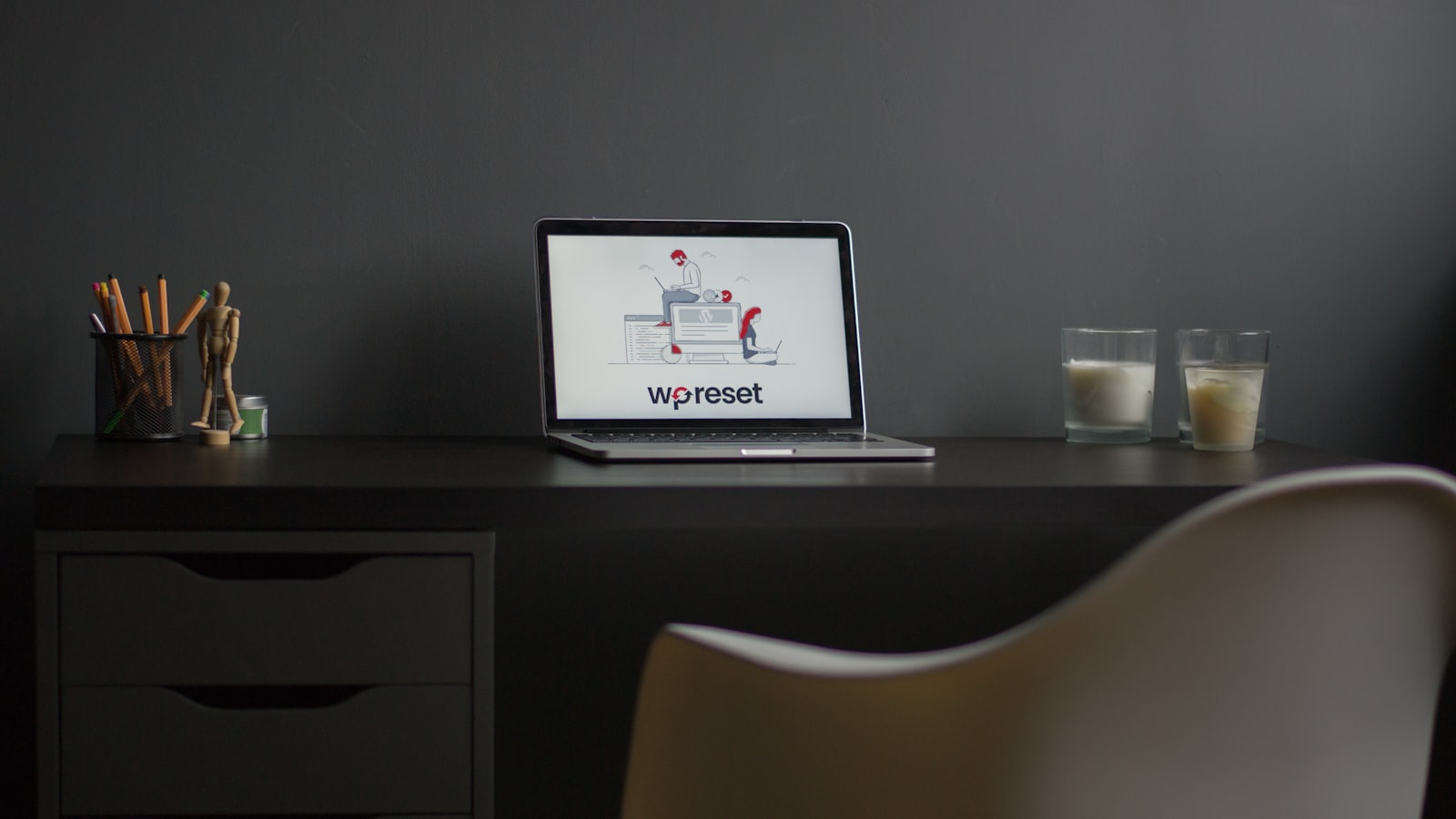 macbook air on black wooden desk