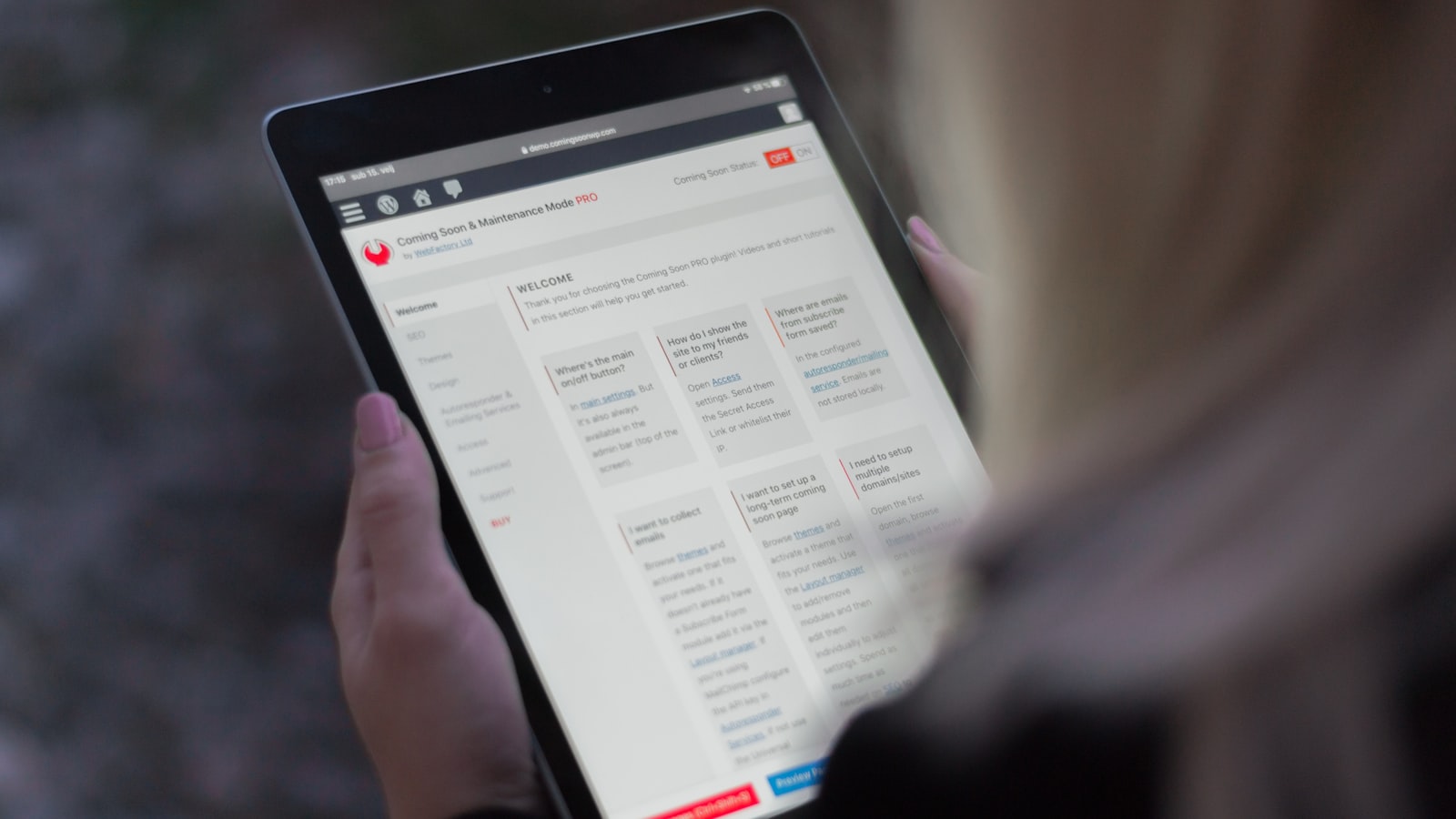 person holding black tablet computer