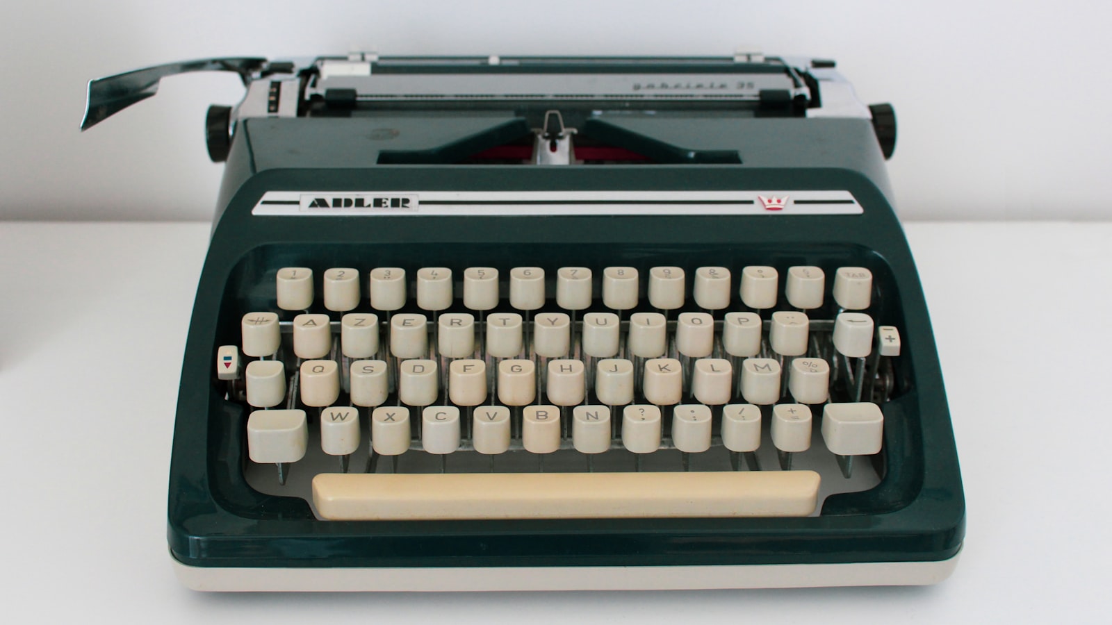 black and white typewriter on white table