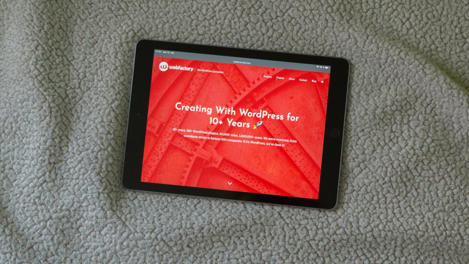 black tablet computer on gray textile