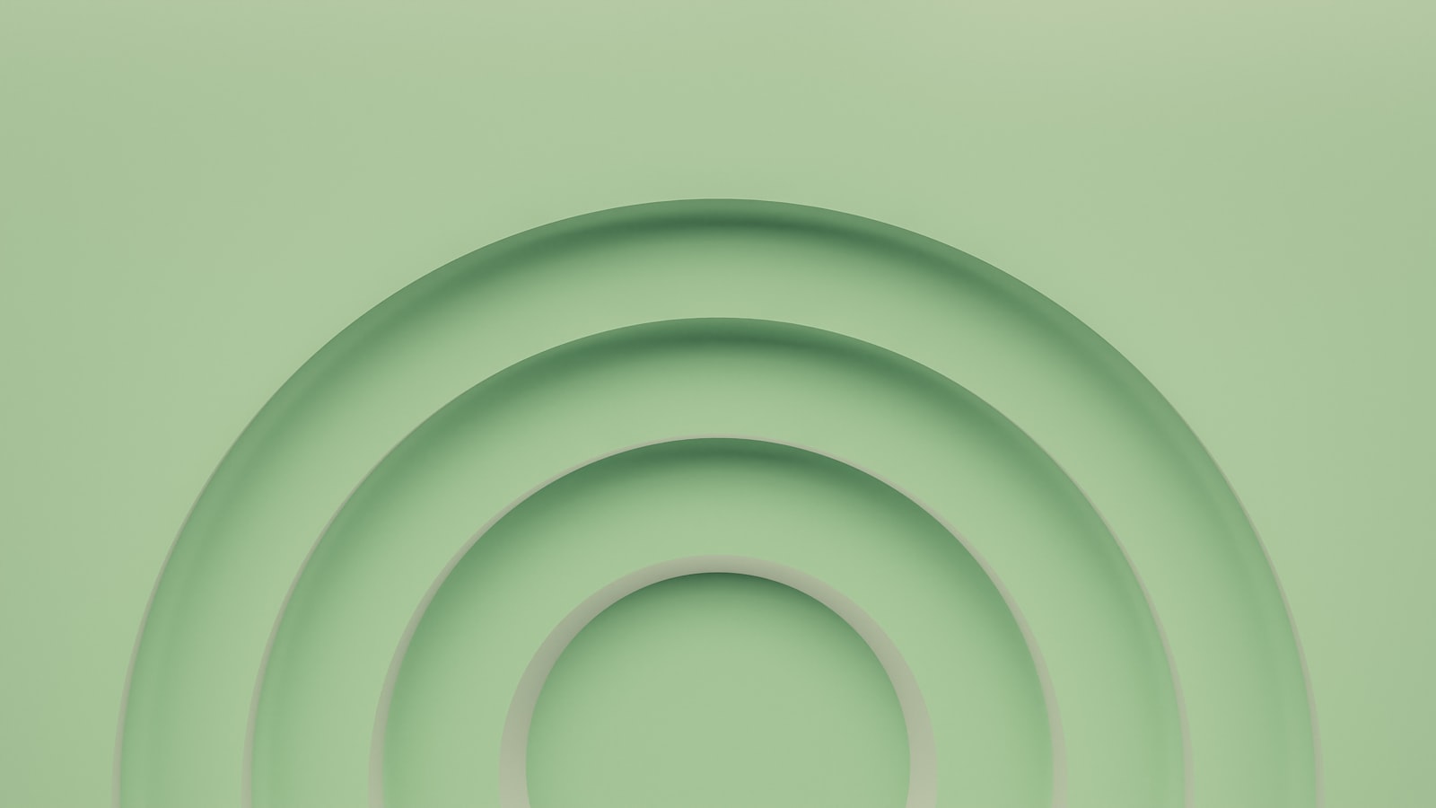 a green background with a circular design in the center
