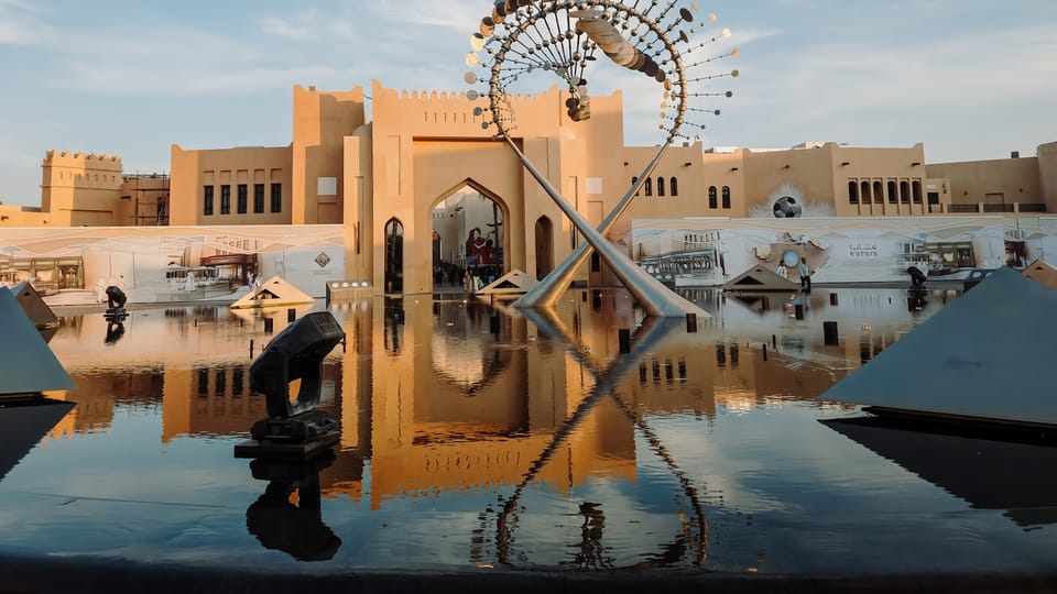 A large building with a ferris wheel on top of it