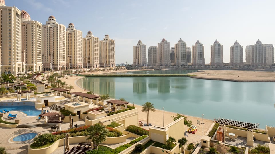 A large body of water surrounded by tall buildings