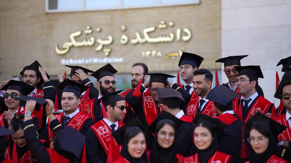Medical school graduates celebrate their achievement and graduation.