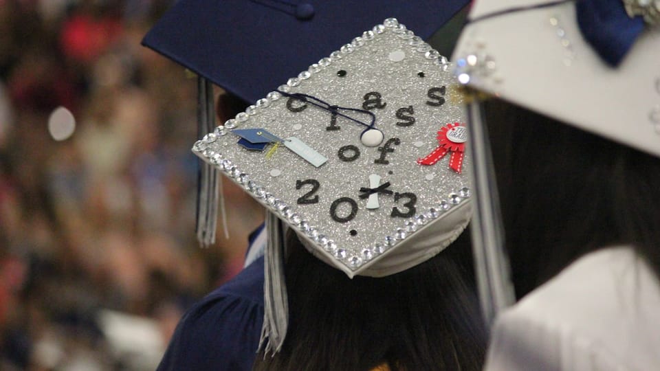A woman in a graduation cap and gown