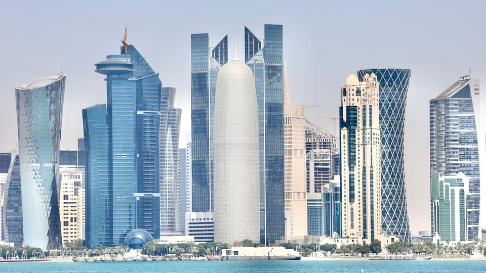 a large body of water in front of a large city