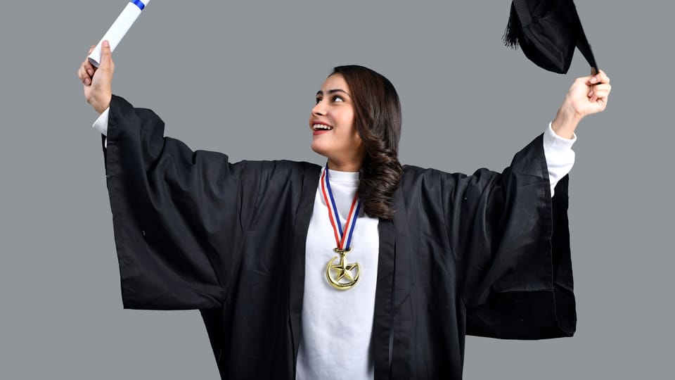 a person holding a diploma