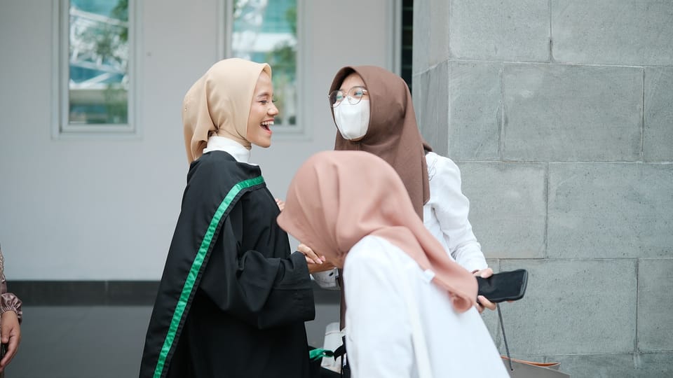 A group of women standing next to each other