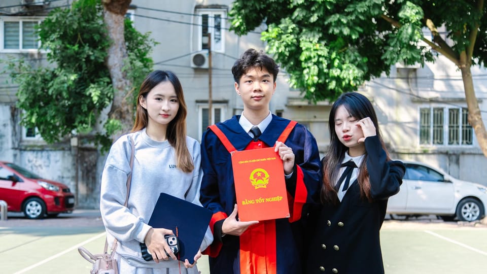 A group of three people standing next to each other