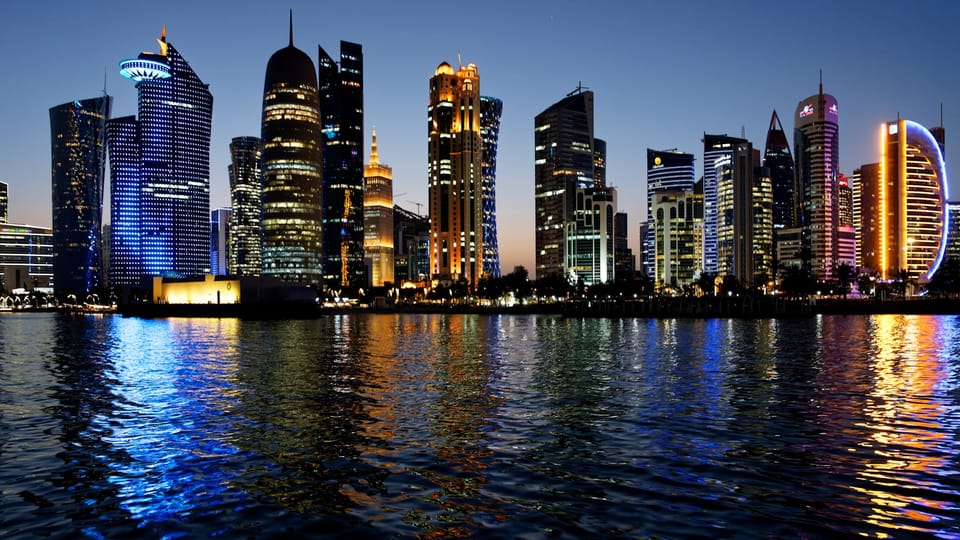 A view of a city at night from across the water