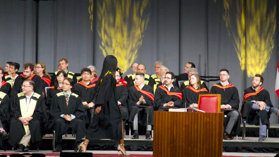 graduate walking on stage