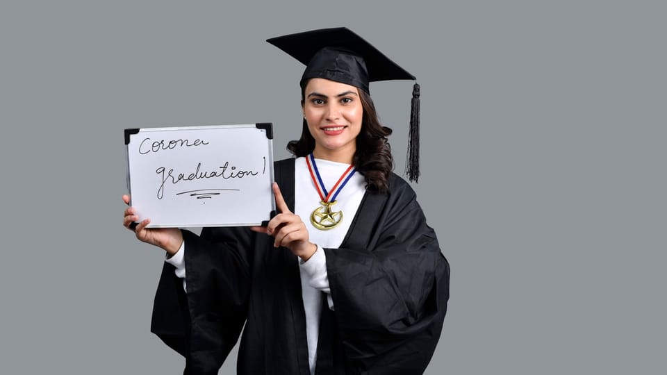 a person holding a diploma and a diploma