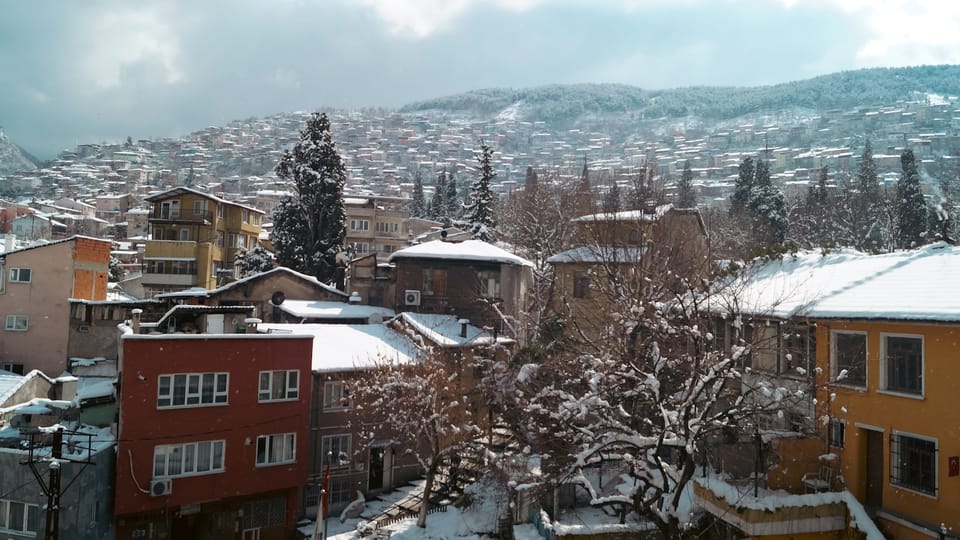 a view of a snow covered town from a window