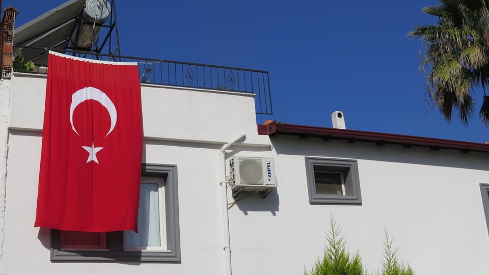 white and red concrete building under blue sky during daytime
