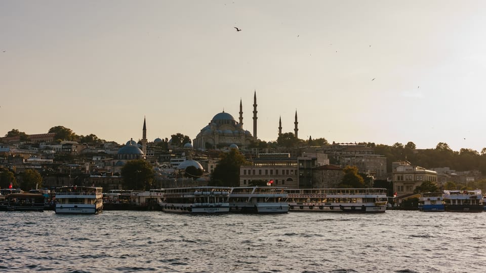 a body of water with boats and buildings along it