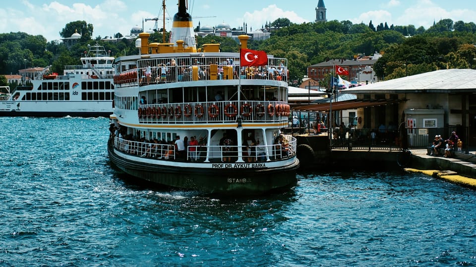white and black boat on water during daytime