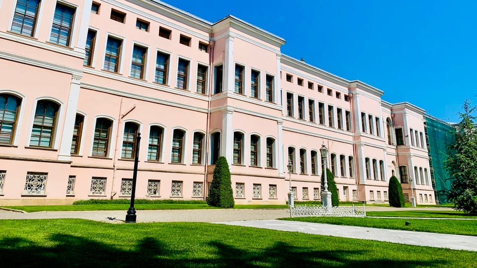 beige concrete building under blue sky during daytime