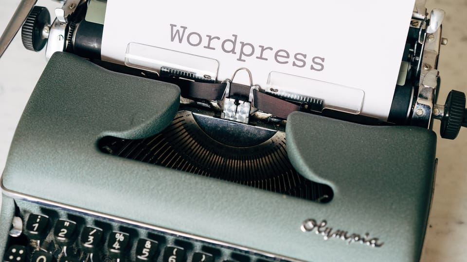 black typewriter on green table