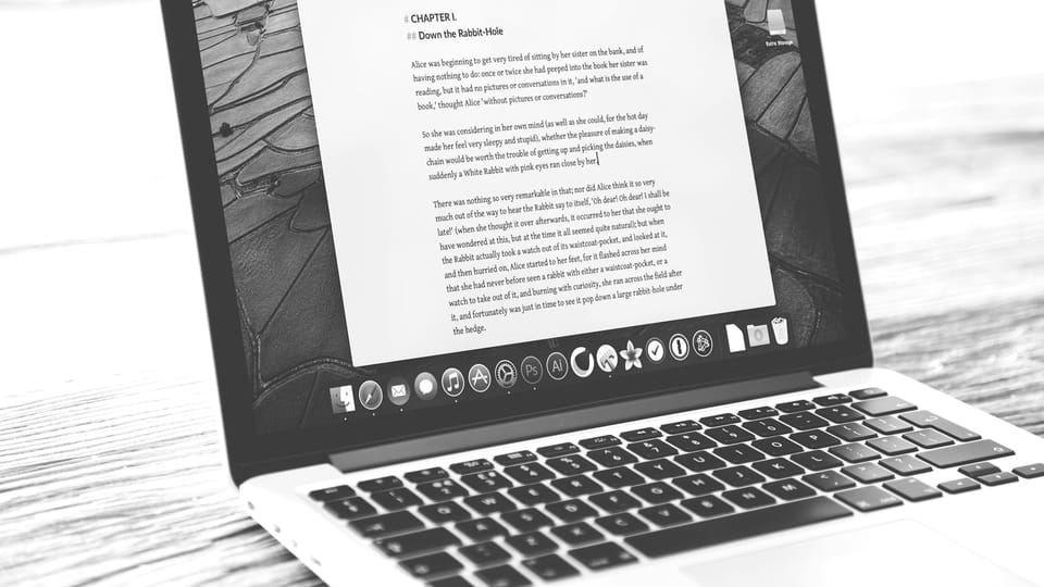 Laptop displays a document, possibly a letter.