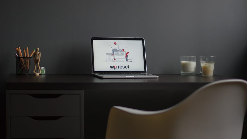 macbook air on black wooden desk