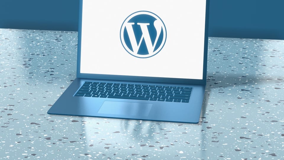 a laptop computer sitting on top of a table