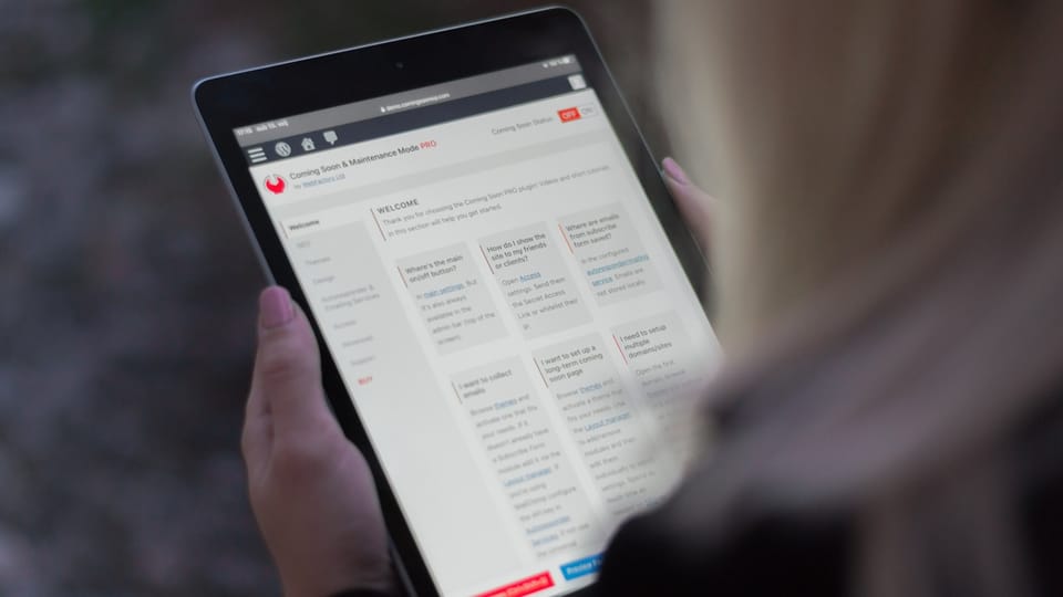 person holding black tablet computer