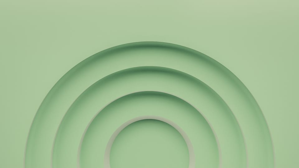 a green background with a circular design in the center